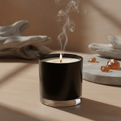 Black candle with smoke on a neutral background