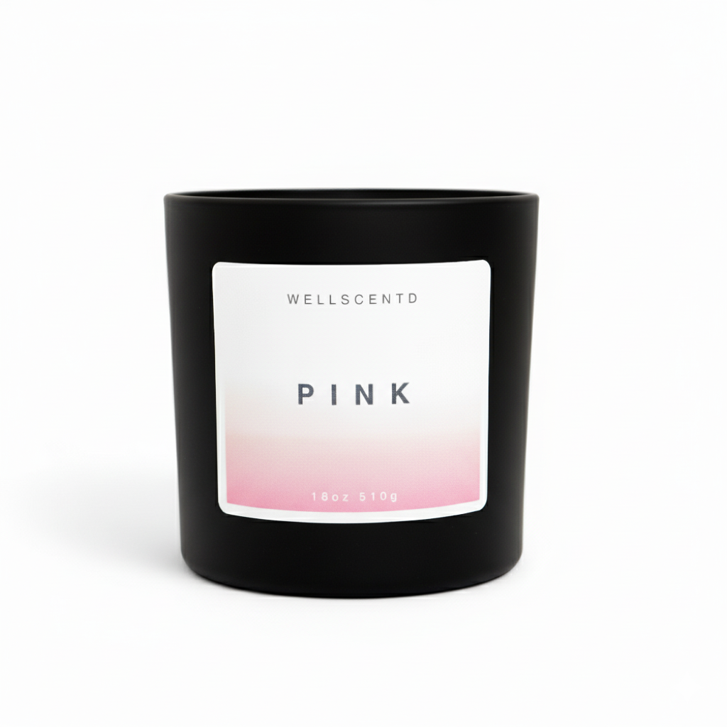 Black candle with a pink and white label on a white background