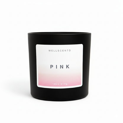 Black candle with a pink and white label on a white background