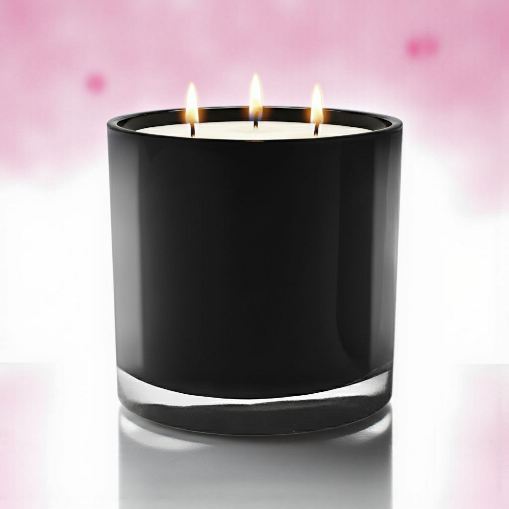 Black candle with three lit wicks on a pink background