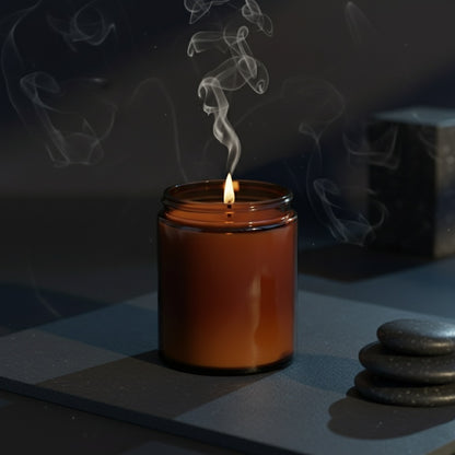 Candle with smoke on a dark surface