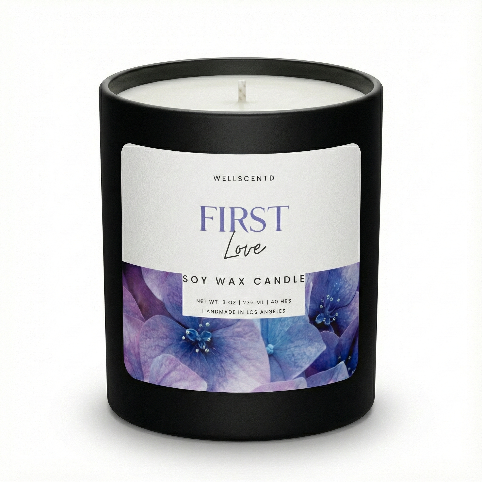 Wellscentd 'First Love' soy wax candle with a black lid on a white background