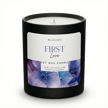 Wellscentd 'First Love' soy wax candle with a black lid on a white background