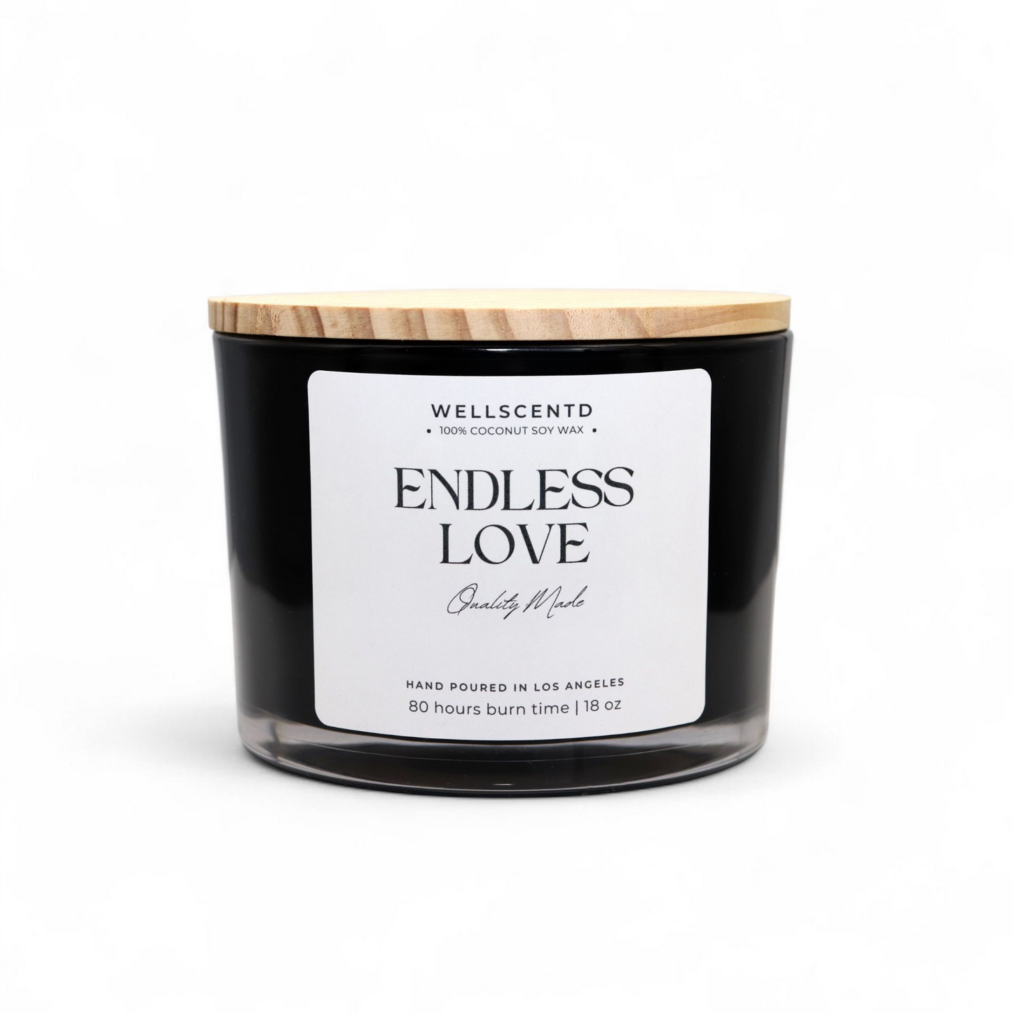 Black candle with a wooden lid labeled 'Endless Love' by Wellscentd on a white background
