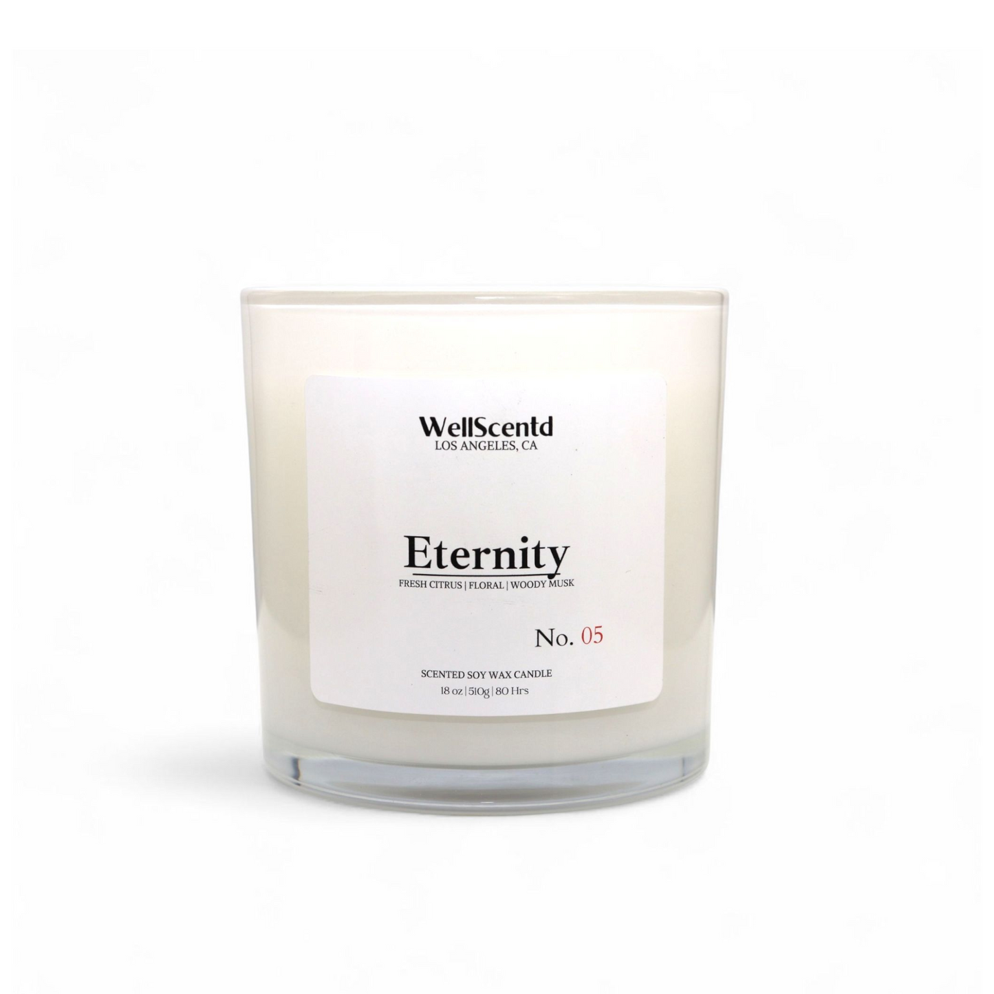 Wellscentd Eternity scented candle – 18oz soy wax, clean citrus and woody musk fragrance, elegant clear vessel with white label, photographed on white background.