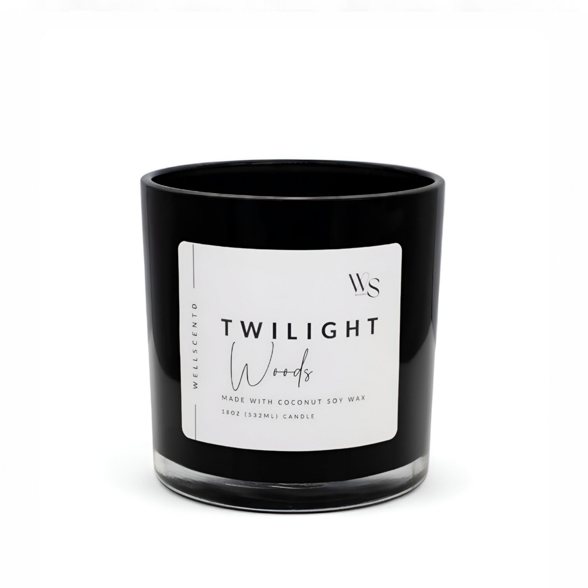 Black candle with a white label on a white background