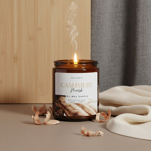 Wellscentd Cashmere Musk candle with smoke and a blanket in the background