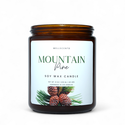 Soy wax candle with a label featuring pinecones and the brand 'Wellscento'.