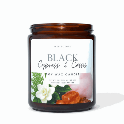 Wellscentd Black Cypress & Cassis soy wax candle in amber jar with floral and wood accents, 8oz, clean-burning and long-lasting fragrance