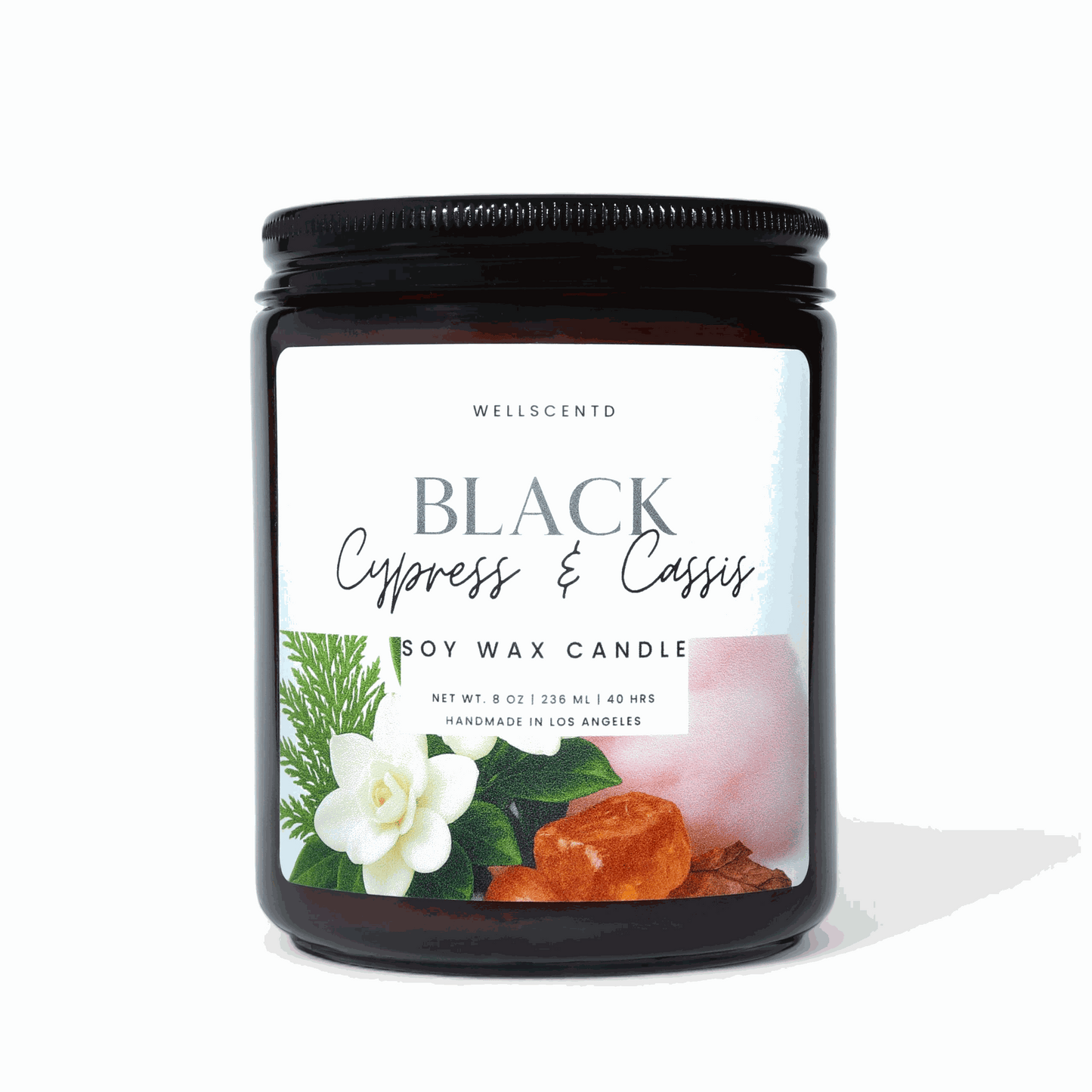 Black Cypress and Cassis soy wax candle in amber jar with natural scent label