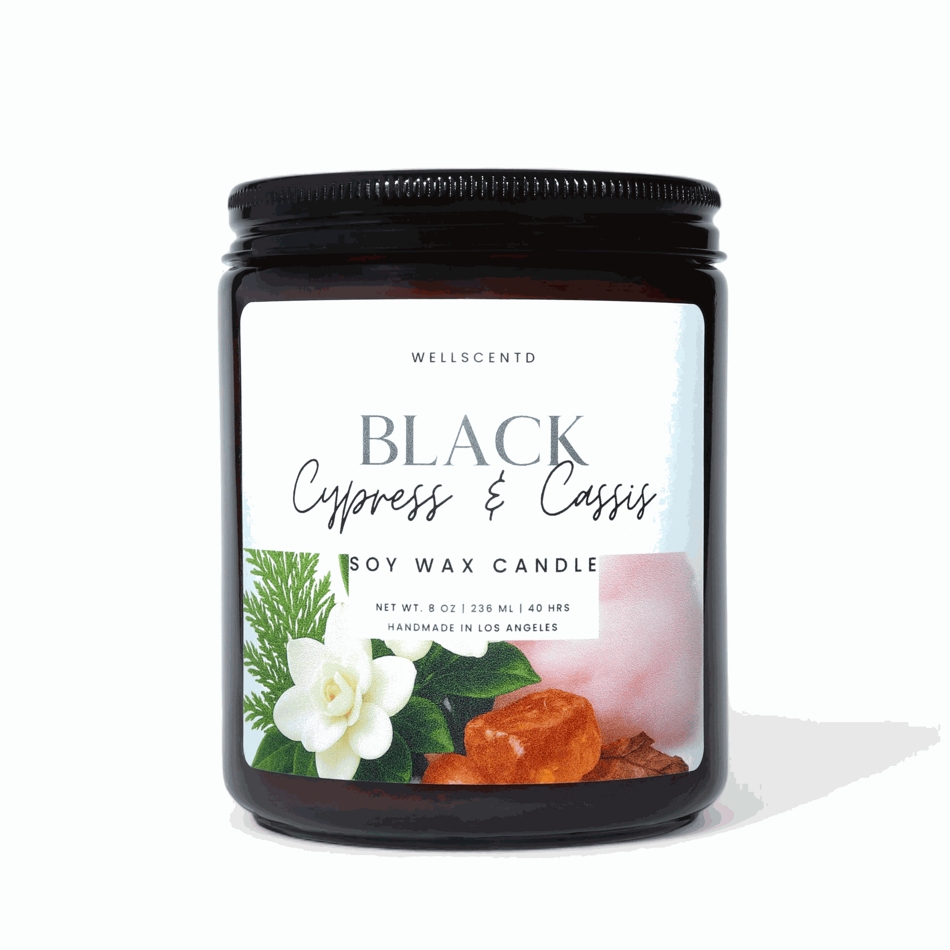 Black Cypress and Cassis soy wax candle in amber jar with natural scent label
