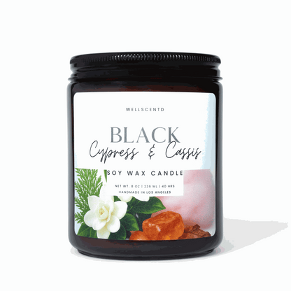 Black Cypress and Cassis soy wax candle in amber jar with natural scent label