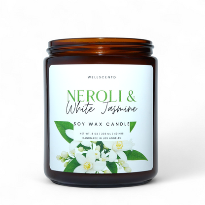 Wellscentd Neroli & White Jasmine Candle in matte black jar with white label featuring jasmine flowers.