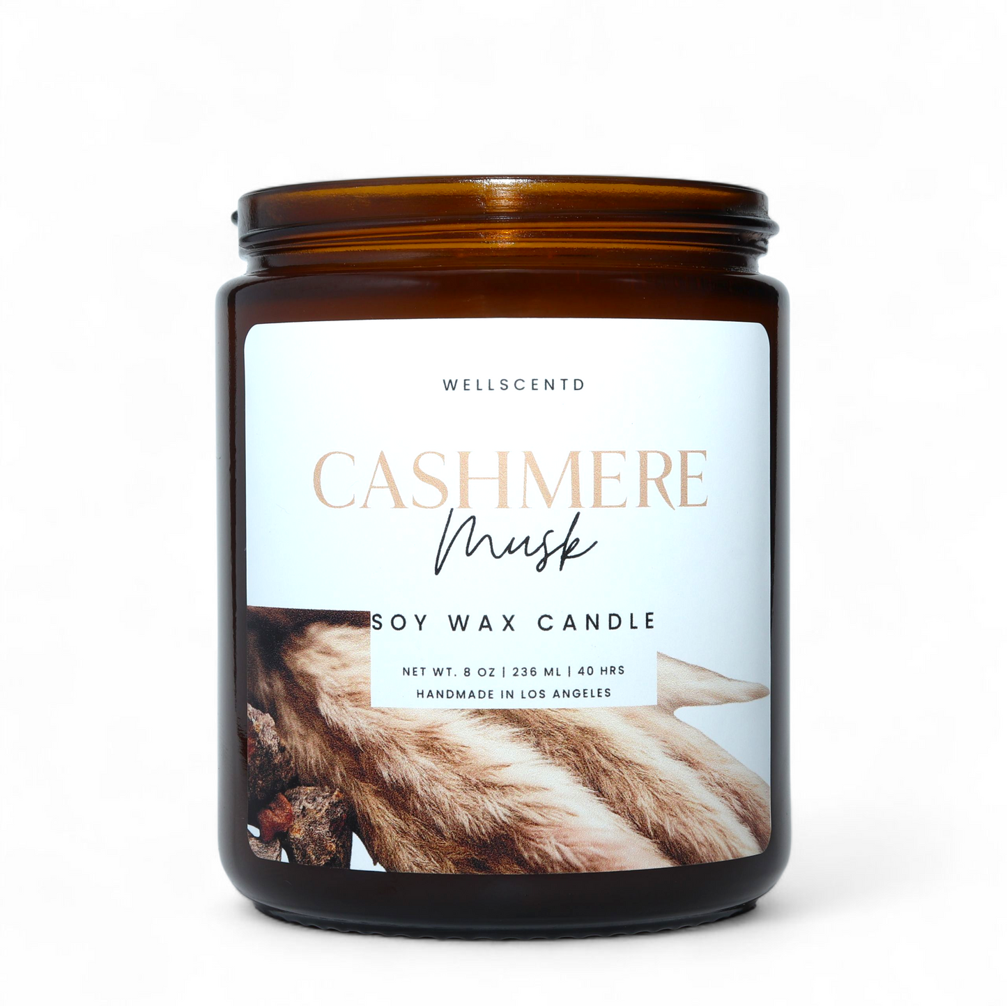 Wellscentd Cashmere Musk soy wax candle with a label on a white background