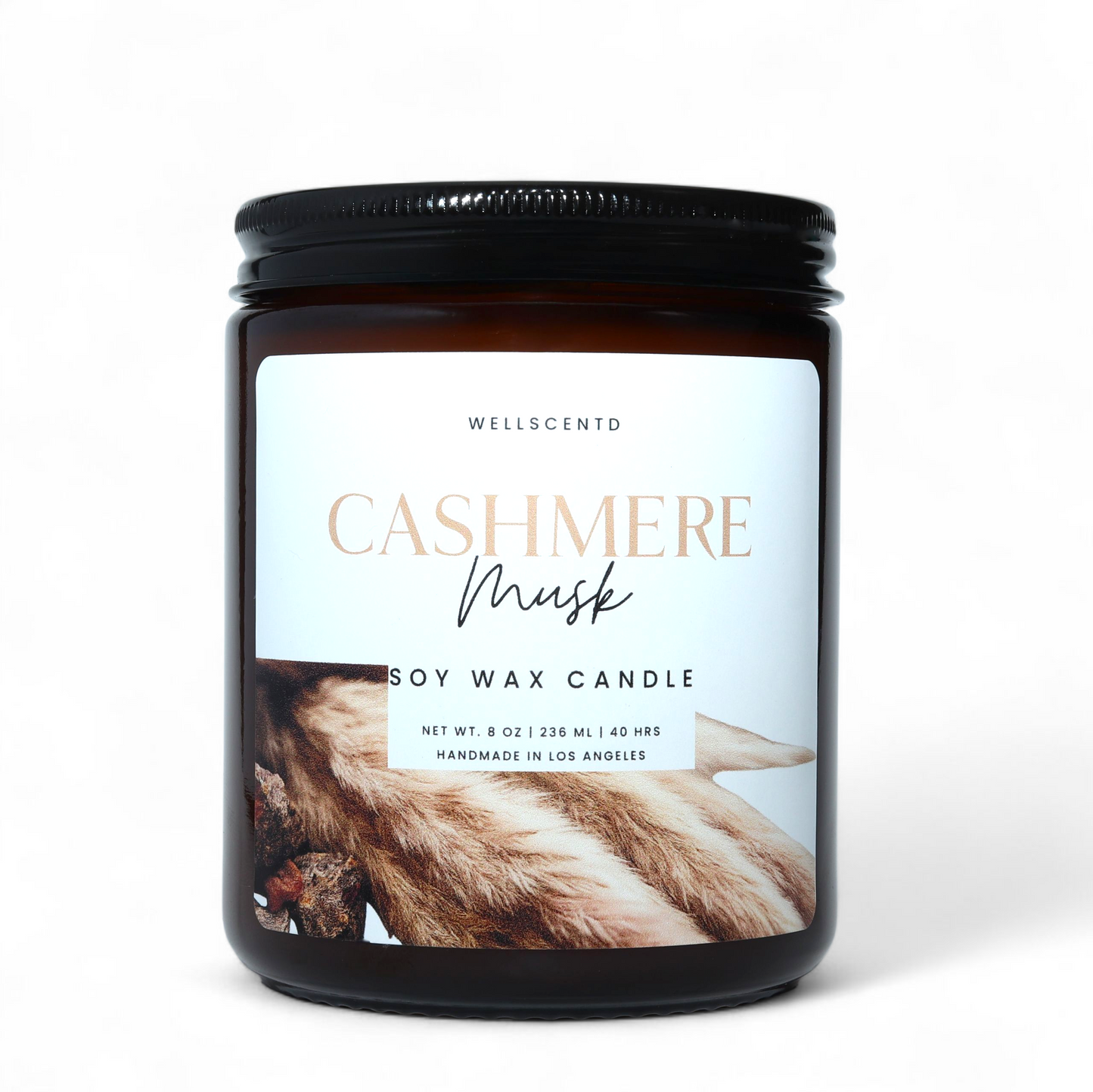 Soy wax candle jar with 'Cashmere Musk' label on a white background
