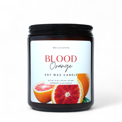 Blood Orange soy wax candle with a black lid on a white background