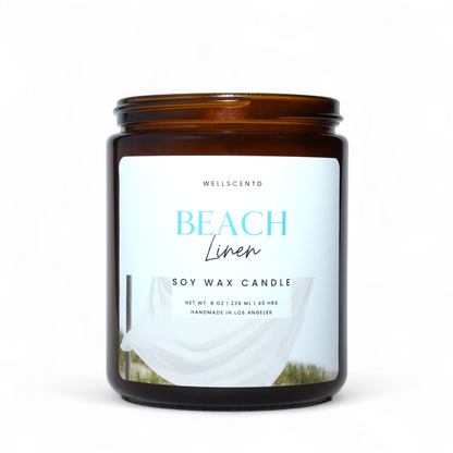 Wellscentd Beach Linen soy wax candle with a label on a white background