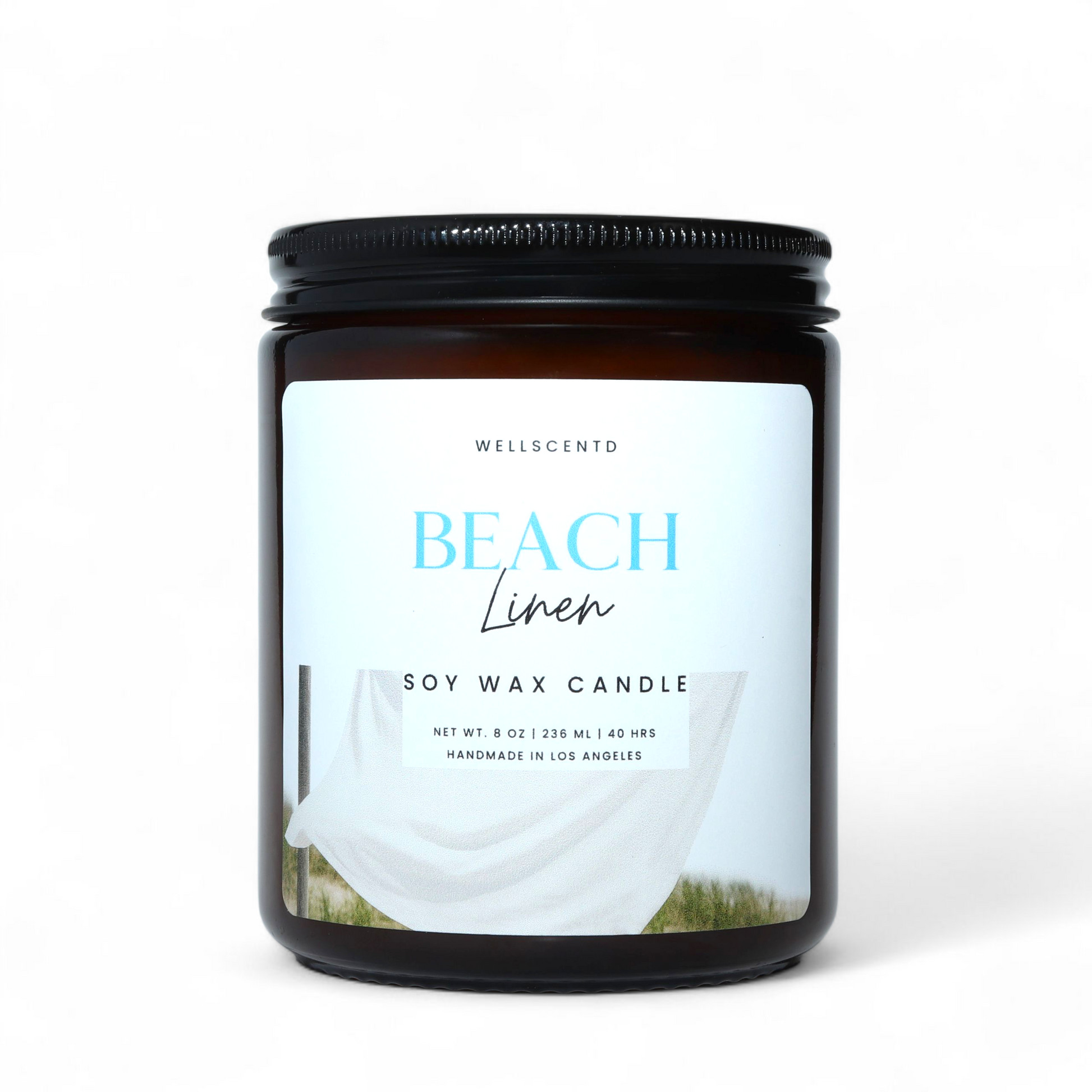 Soy wax candle labeled 'Beach Linen' by Wellscento on a white background