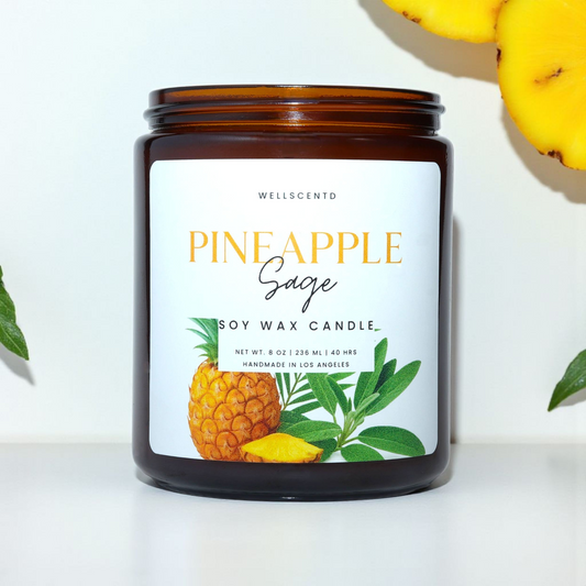 Soy wax candle labeled 'Pineapple Sage' with a pineapple and leaf design on a white background.