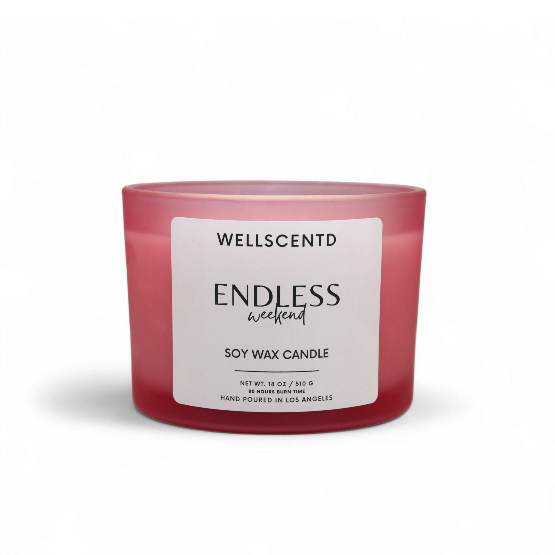 Wellscentd Endless Weekend candle with frosted pink glass jar and white label – 18oz soy wax, modern minimalist design, photographed on a white background.