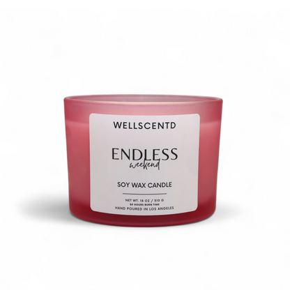 Wellscentd Endless Weekend candle with frosted pink glass jar and white label – 18oz soy wax, modern minimalist design, photographed on a white background.
