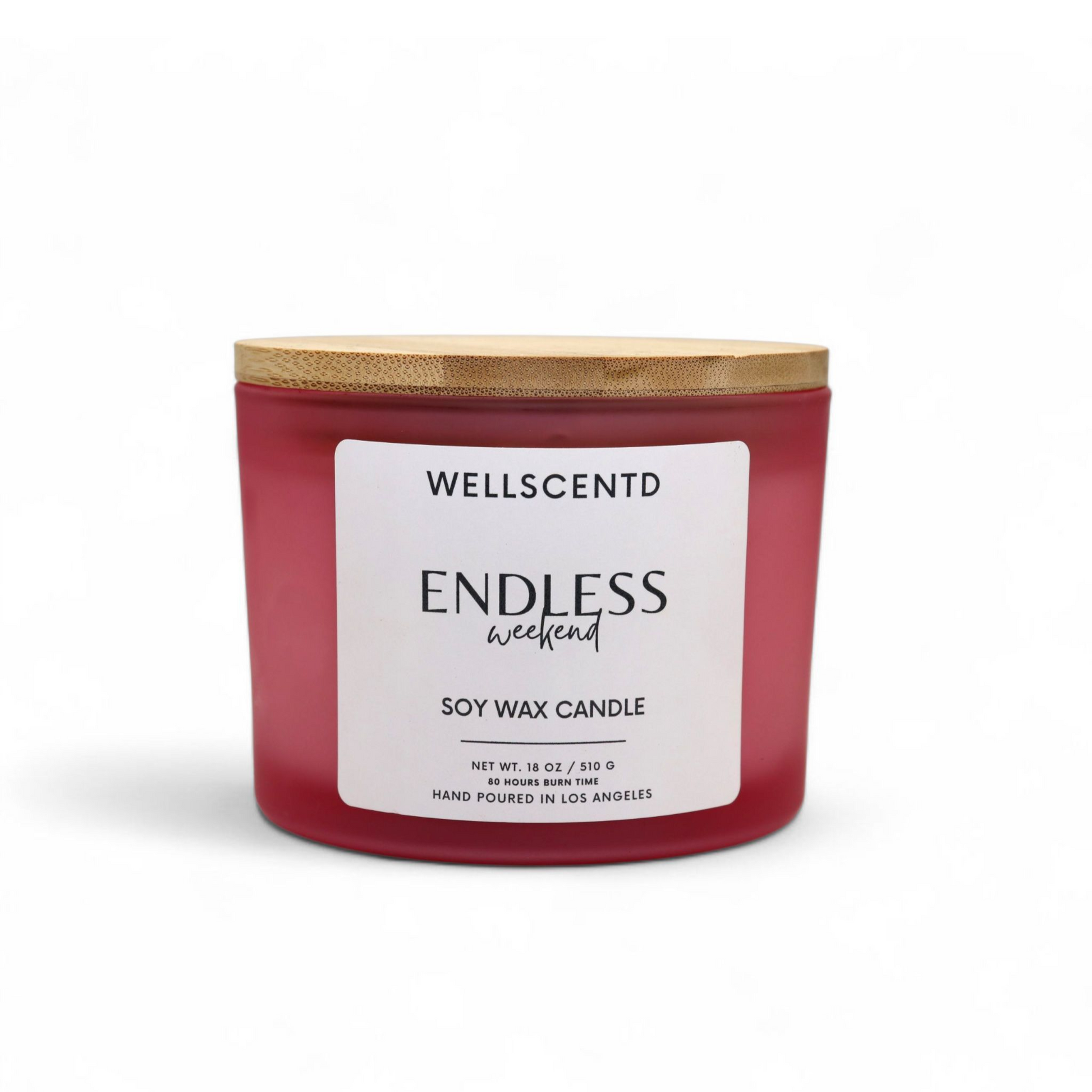 Wellscentd Endless Weekend luxury candle in a frosted pink glass jar with bamboo lid – 18oz soy wax, clean white label, hand-poured, product image on white background.